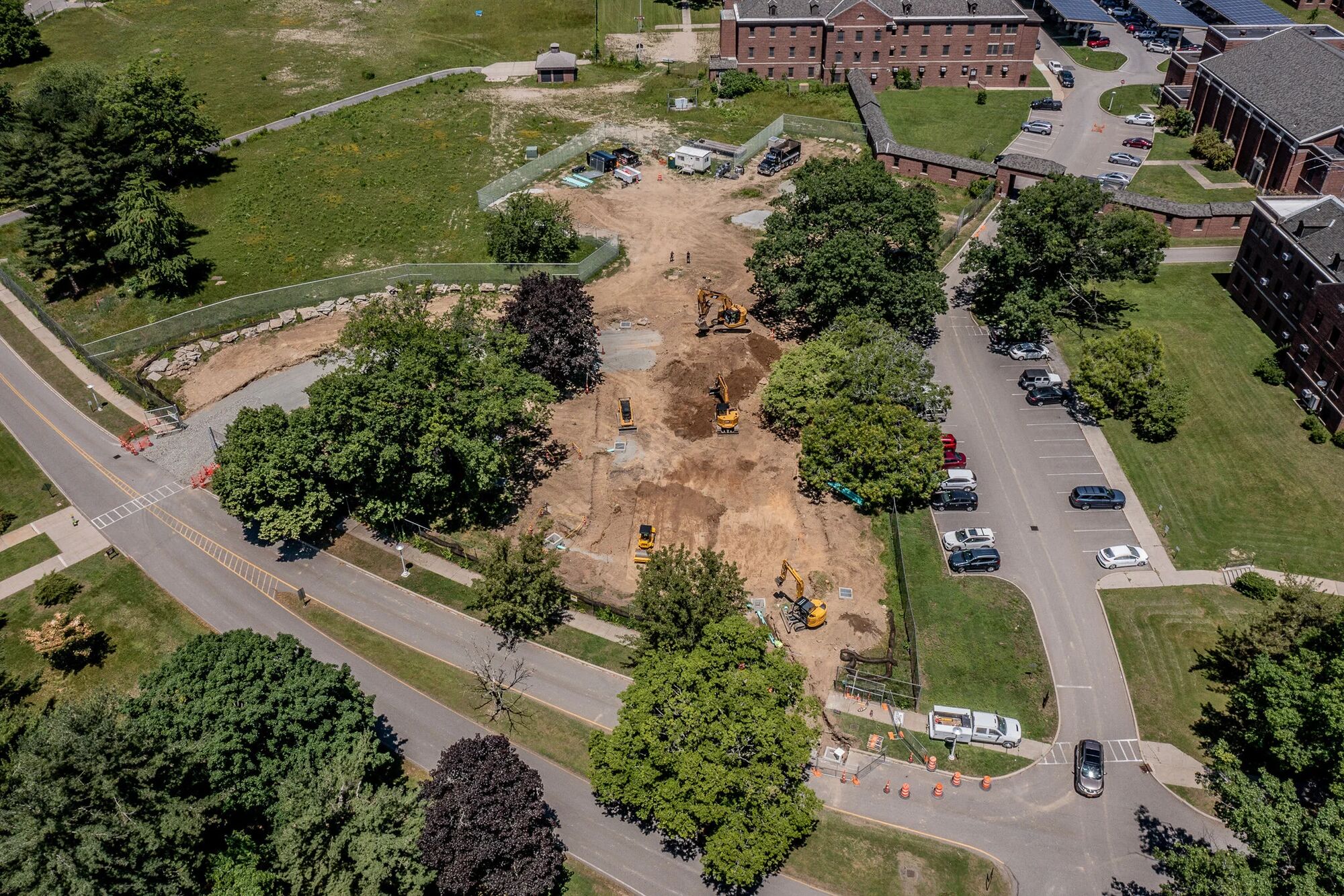 Aerial view of a maintained VA campus with mown grounds, drives, and parking areas