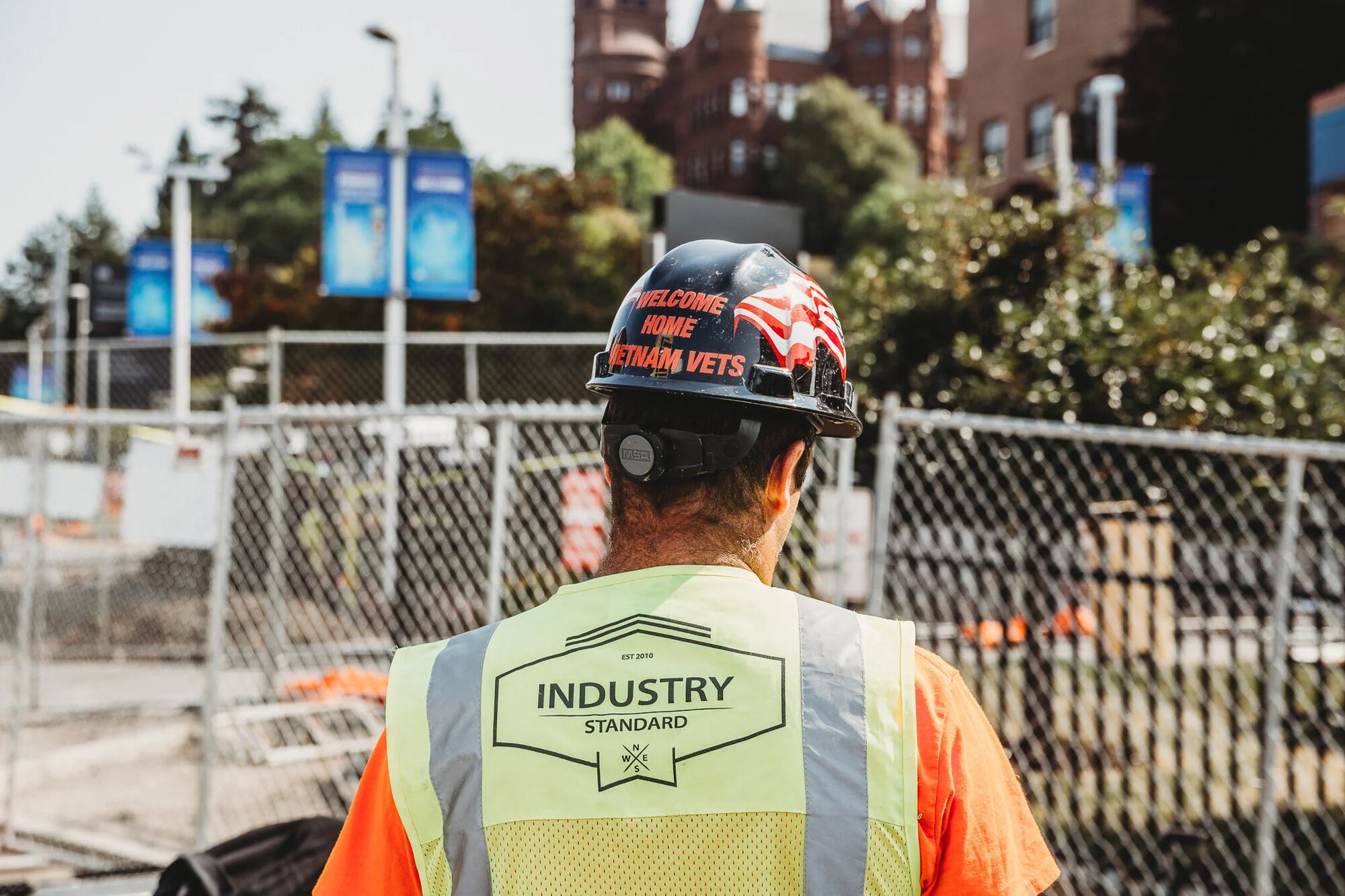 Industry Standard USA crew members in branded high-visibility vests on a jobsite